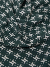 The Green/White Rhodes 8 Cotton Road Shirt is displayed as a flat lay against a plain white background. The shirt features a prominent green and white checkered pattern and is designed with a relaxed camp collar and short sleeves. It has a central button-down front and a single patch pocket on the left chest. The fabric appears lightweight with a textured cotton finish.