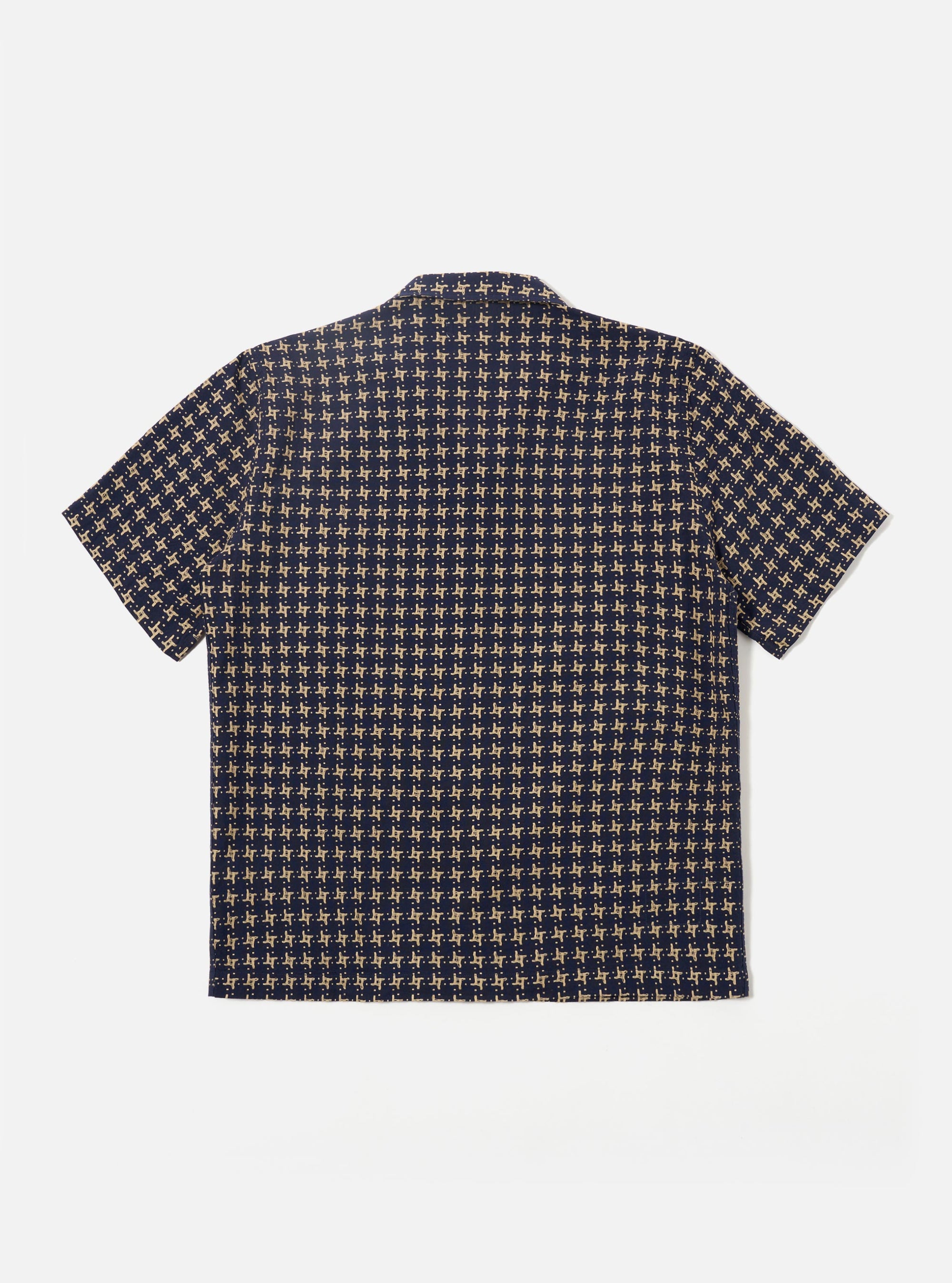 The Navy/Sand Rhodes 8 Cotton Road Shirt is shown from the back as a flat lay against a plain white background. The shirt features a straight hem, short sleeves, and a clean back panel with a central hanging loop at the neck. The fabric has a distinct textured pattern in navy and sand tones.