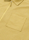 The Yellow Mykonos Cotton Zip Shirt is shown from the back as a flat lay against a plain white background. The image highlights the shirt's relaxed fit, straight hem, and the detailed pattern of the yellow Mykonos cotton fabric. A simple horizontal yoke is visible across the shoulders.