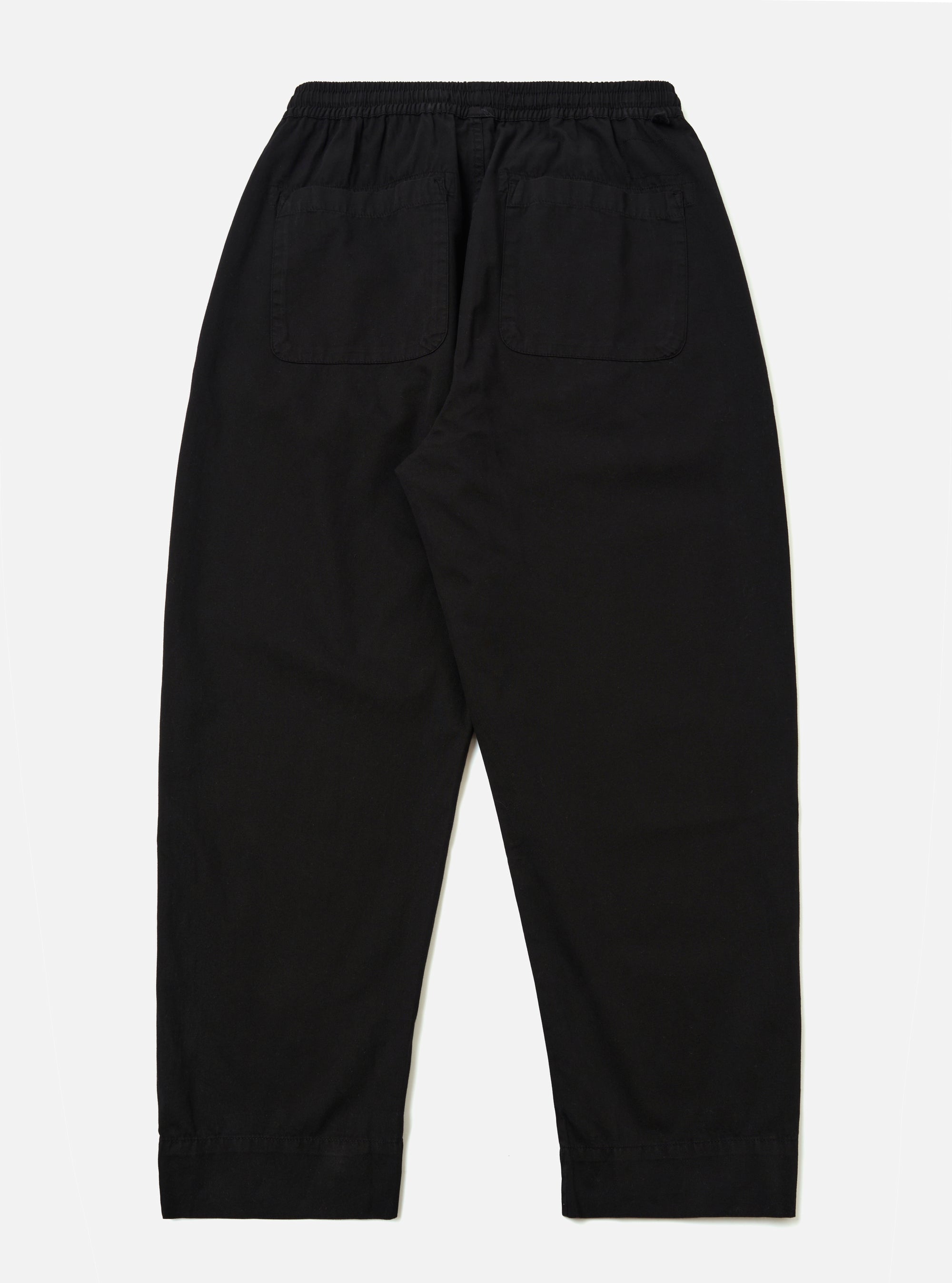 The Black Kelly Cotton Judo Pant is shown from the back as a flat lay against a plain white background. The image highlights the relaxed fit, the elasticated drawstring waist, and two large rear patch pockets.