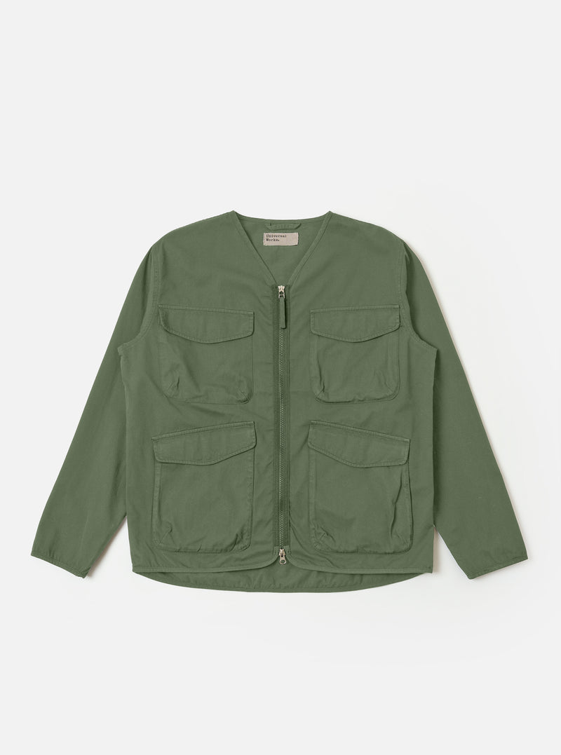 The Olive Kelly Cotton Glider Jacket is shown as a flat lay against a plain white background. The jacket features a full-length central zipper, a classic pointed collar, and two large patch pockets at the waist. The olive green cotton fabric has a smooth, durable appearance with visible stitching details along the seams and pockets.