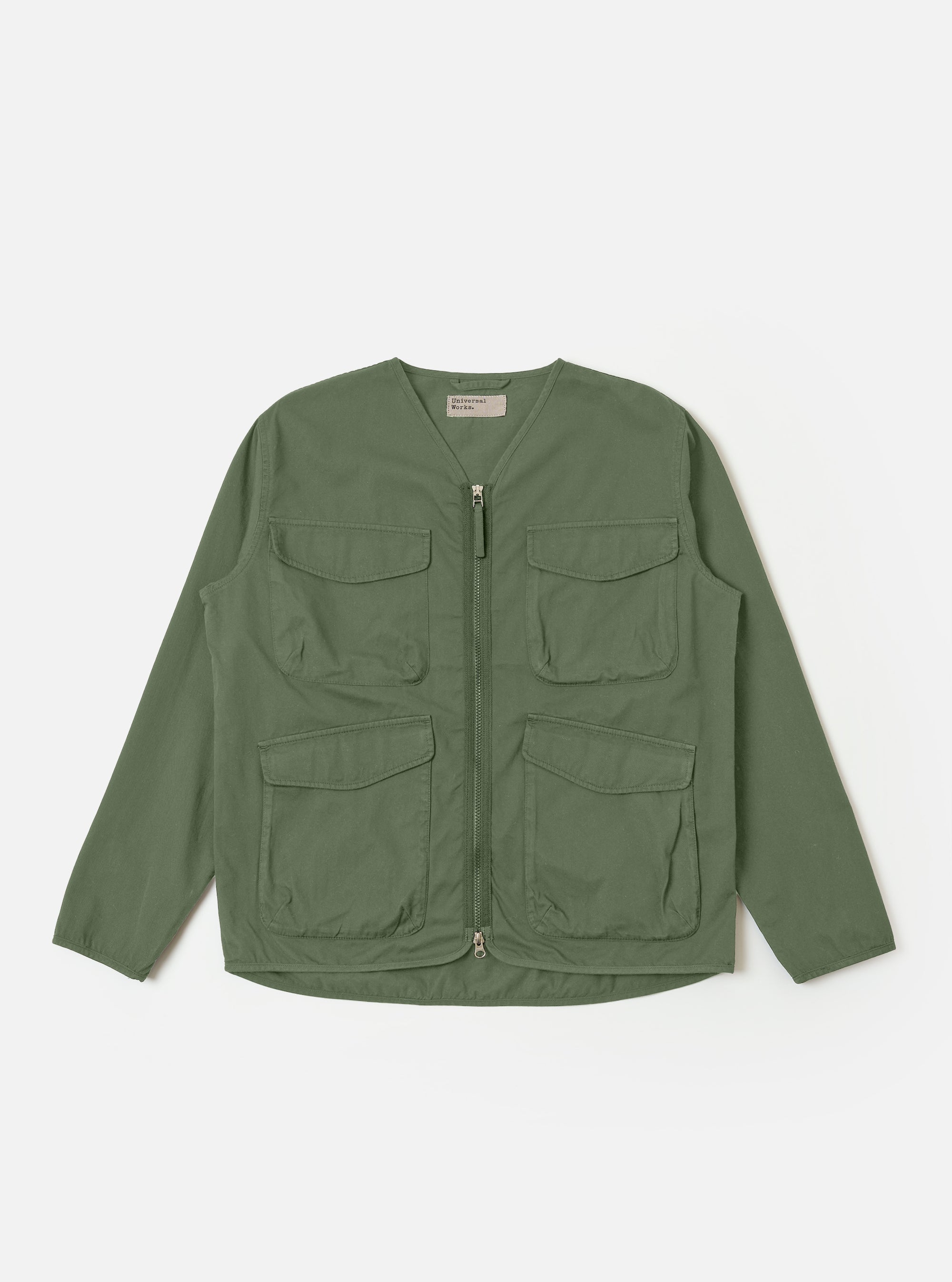 The Olive Kelly Cotton Glider Jacket is shown as a flat lay against a plain white background. The jacket features a full-length central zipper, a classic pointed collar, and two large patch pockets at the waist. The olive green cotton fabric has a smooth, durable appearance with visible stitching details along the seams and pockets.