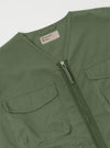 The Olive Kelly Cotton Glider Jacket is shown from the back as a flat lay against a plain white background. The image highlights the jacket's collarless design with bound edges, a straight hem, and a simple one-piece back panel with a central vertical seam. The olive green cotton fabric has a smooth, matte finish.
