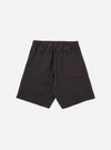 The Licorice Lyo Linen Mix Simple Short is shown as a flat lay against a white background. These brown shorts feature an elasticated waistband with an adjustable drawstring, side angled pockets, and a relaxed, wide-leg fit. The fabric has a visible textured weave characteristic of a linen-lyocell blend.
