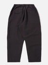 The Licorice Lyo Linen Mix Oxford Pant is shown from the rear as a flat lay against a plain white background. The image highlights the dark brown fabric and features a visible elasticated waistband with a drawstring and two rear patch pockets. The trousers have a loose, wide-leg fit.