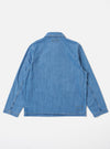 The Washed Indigo 8oz Slub Denim Field Jacket is shown from the back as a flat lay against a plain white background. The image highlights the textured, slubby appearance of the indigo-washed denim and the clean, simple construction of the jacket's rear panel.