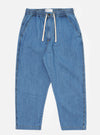The Washed Indigo 8oz Slub Denim Hi Water Trouser is shown as a flat lay against a plain white background. The trousers feature an adjustable drawstring waist, two slanted front pockets, and a slightly cropped leg length. The 8oz slub denim fabric has a washed indigo finish with a visible textured appearance.