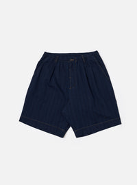 The Indigo Recycled Herringbone Pleated Track Short is shown as a flat lay against a white background. The shorts feature a visible herringbone weave pattern in indigo blue, front pleats, and an elasticated waistband with an adjustable drawstring.