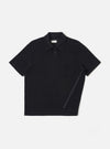 The Black Light Weight Terry Newlyn Polo is shown as a flat lay against a white background. The polo features a three-button placket, a classic collar, and short sleeves. The fabric has a soft, fine-looped terry texture in a solid black color.