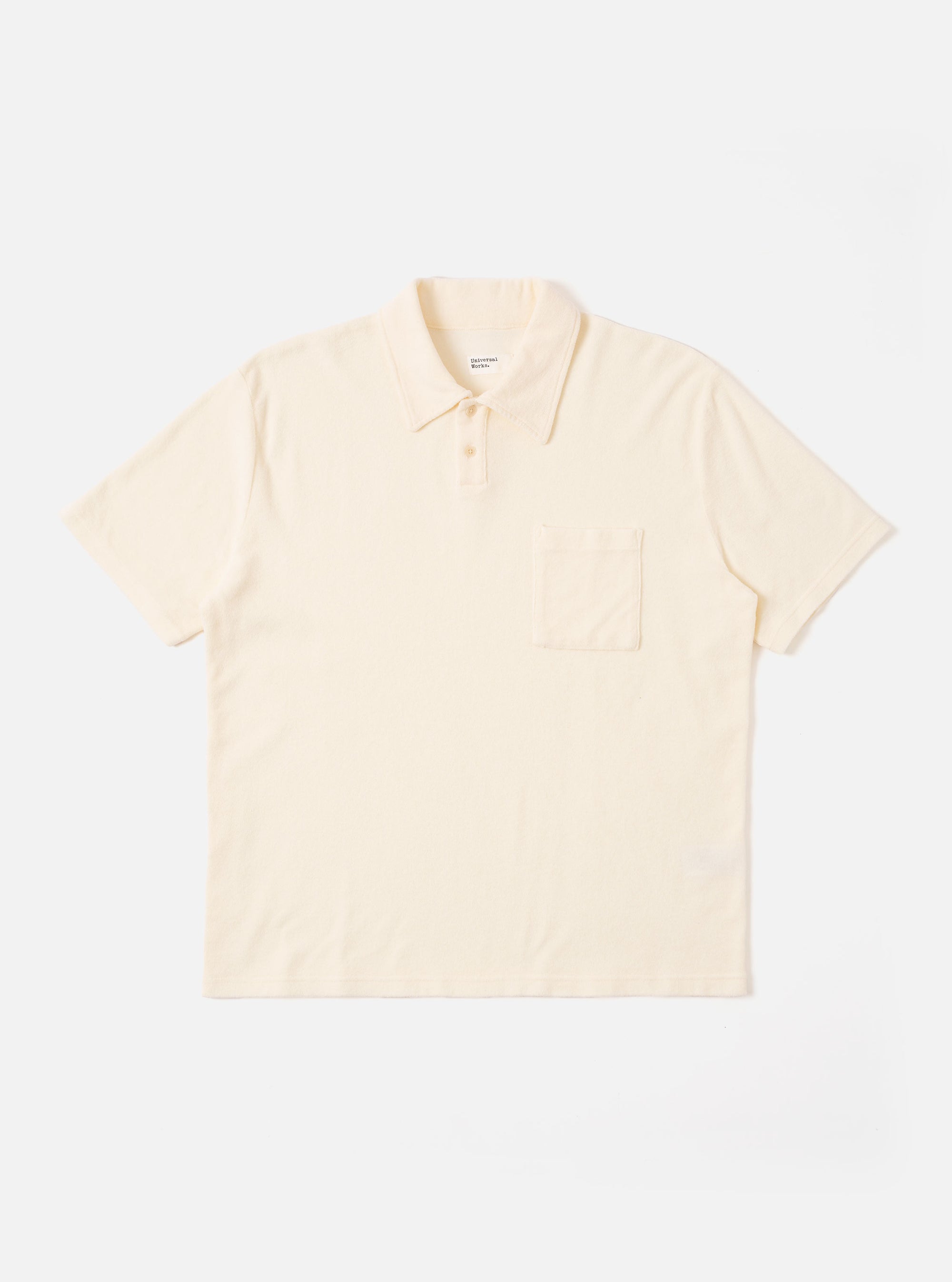The Ecru Light Weight Terry Newlyn Polo is shown as a flat lay against a white background. The polo features a classic collar, a short button placket, and short sleeves. The fabric has a visible textured light weight terry finish in a soft ecru color.