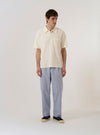 The Ecru Light Weight Terry Newlyn Polo is shown as a flat lay against a plain white background. The polo shirt features a three-button placket, a classic polo collar, and a single patch pocket on the left chest. The fabric has a soft, textured terry finish in a solid ecru color.