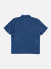 The Navy Light Weight Terry Newlyn Polo is shown from the back as a flat lay against a plain white background. The image highlights the textured navy terry fabric, the back of the collar, and the clean hemline of the garment.