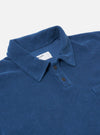 The Navy Light Weight Terry Newlyn Polo is shown as a flat lay from the back against a plain white background. The image highlights the rear construction of the navy blue garment, featuring a straight hem with small side splits and a simple one-piece collar.