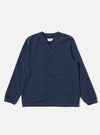 The Navy Maiorca Jersey Cardigan is shown as a flat lay against a white background. The cardigan features a curved v-neck collar, a five-button front closure, one single patch chest pocket, and two large patch hand pockets. It is finished with cotton rib-bound cuffs and a matching rib-bound hem. The fabric has a distinct textured basket-weave pattern in a deep navy indigo look.