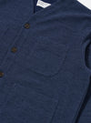 The Navy Maiorca Jersey Cardigan is displayed from the back as a flat lay against a white background. The image highlights the garment's textured, patterned jersey fabric and the soft cotton rib-bound cuffs and hem.
