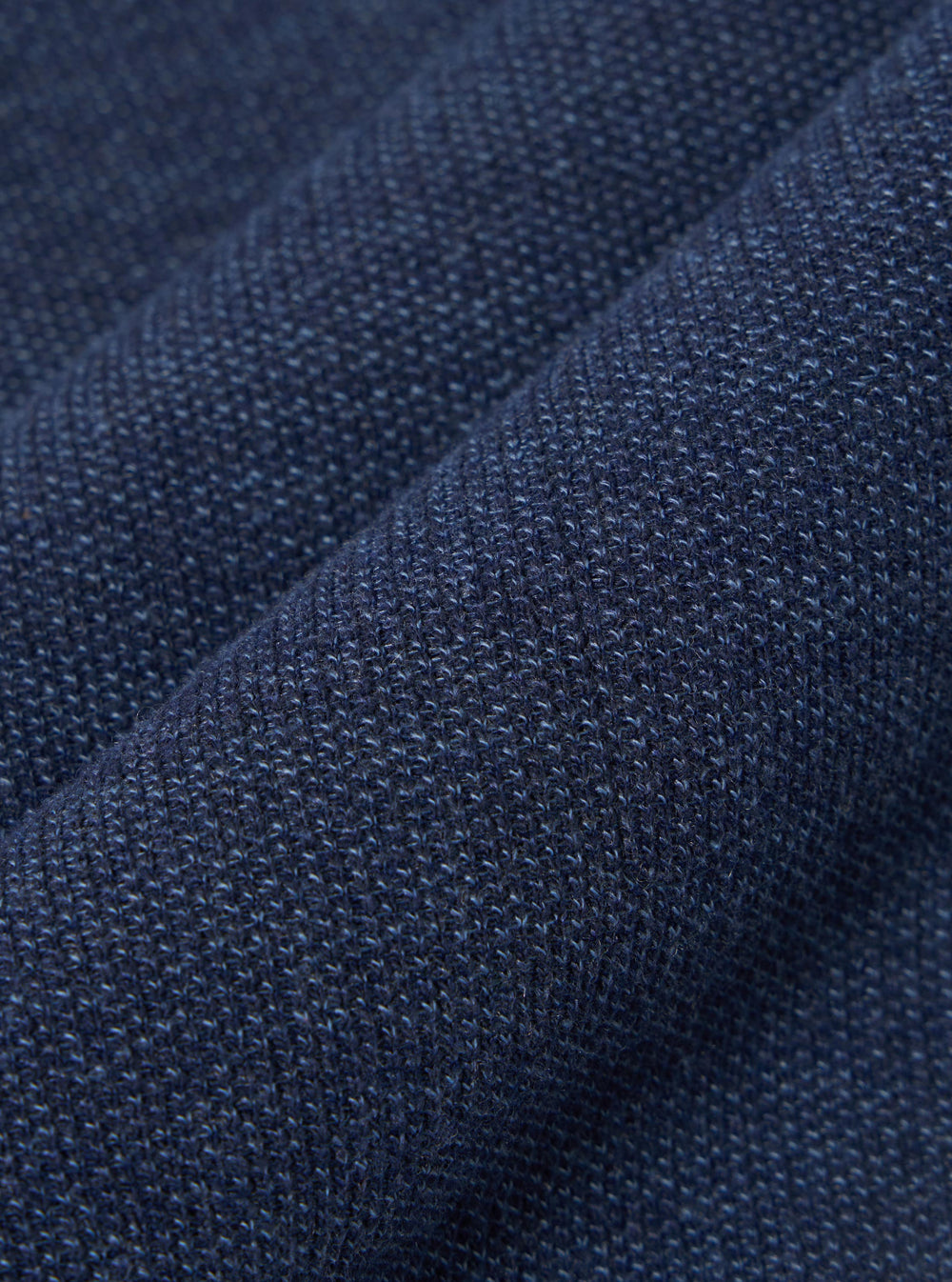 A close-up swatch image of the Navy Maiorca Jersey Cardigan fabric highlights a textured, woven pattern in a deep navy blue. The fabric has a distinct interlaced appearance with subtle variations in color.
