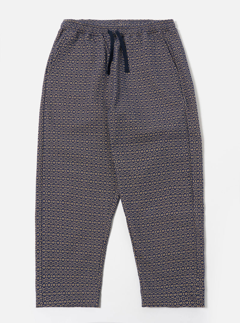 The Navy Konos Cotton Judo Pant is shown as a flat lay against a white background. The trousers feature a relaxed, straight-leg fit, an elasticated waistband with an external drawcord, and two front slanted pockets. The dark navy cotton fabric has a subtle, textured pattern throughout.