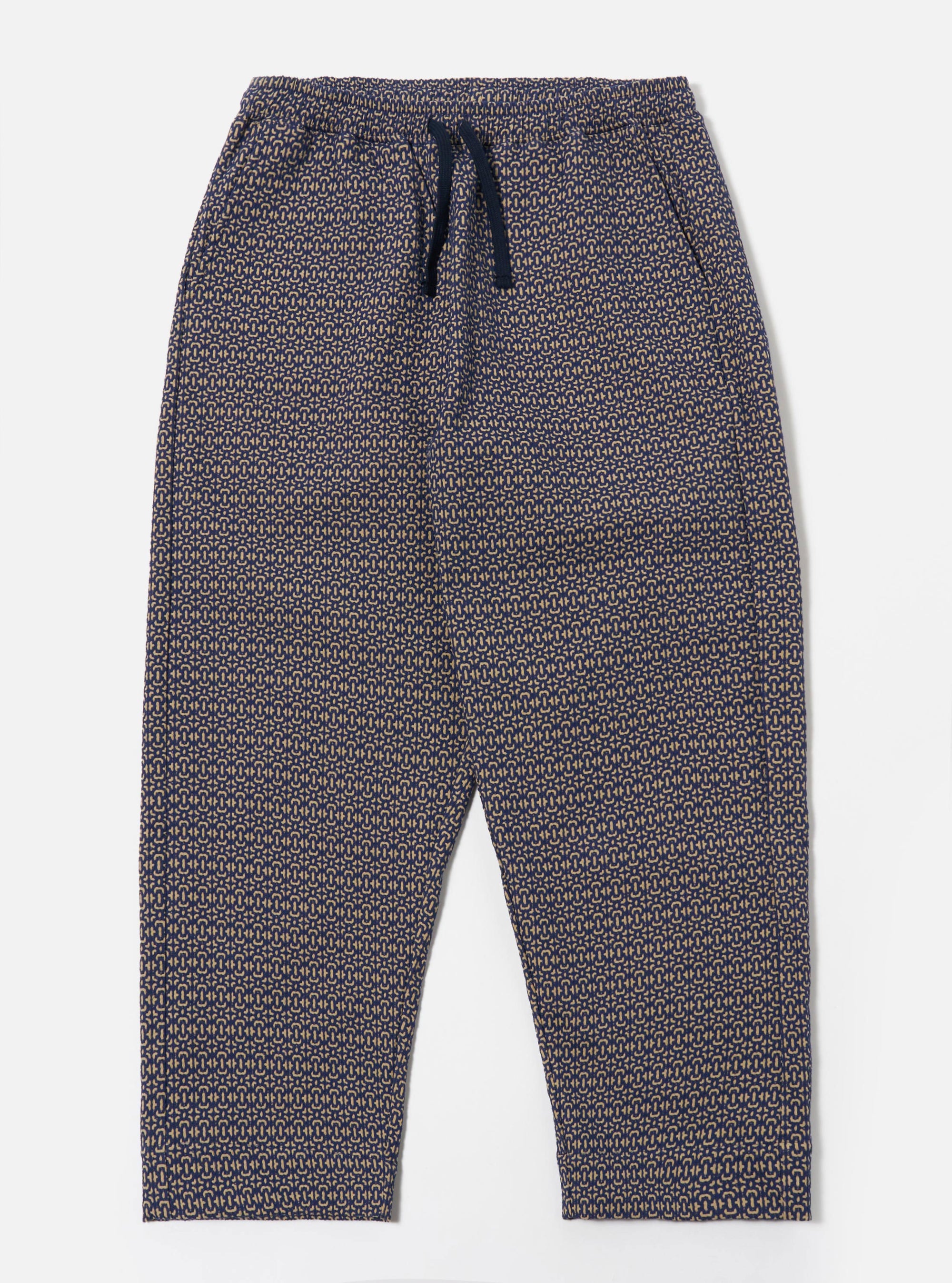The Navy Konos Cotton Judo Pant is shown as a flat lay against a white background. The trousers feature a relaxed, straight-leg fit, an elasticated waistband with an external drawcord, and two front slanted pockets. The dark navy cotton fabric has a subtle, textured pattern throughout.