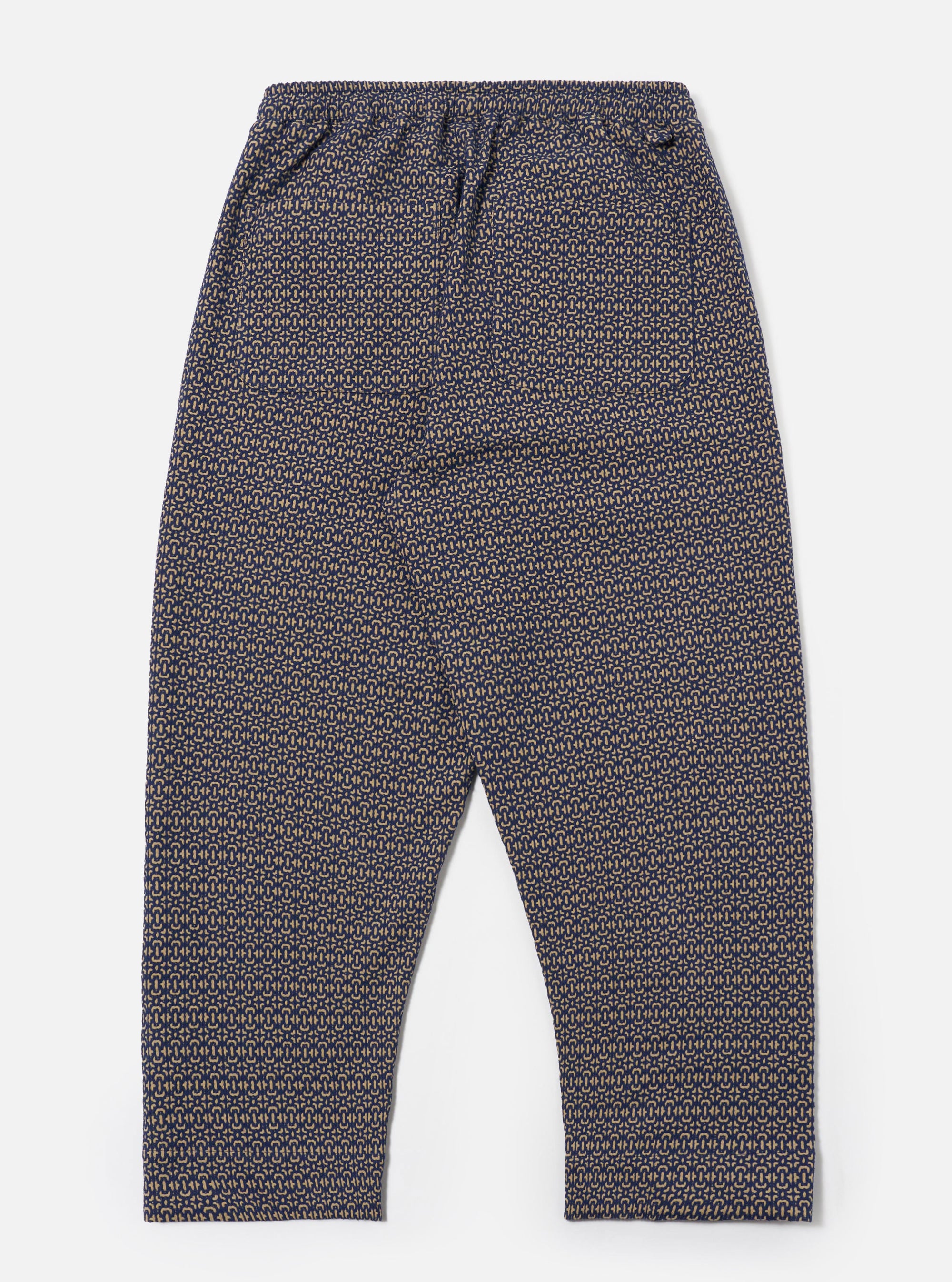 The Navy Konos Cotton Judo Pant is shown from a rear angle as a flat lay against a plain white background. The image highlights the two rear patch pockets and the elasticated waistband with a hanging loop. The navy blue cotton fabric features a subtle textured finish.