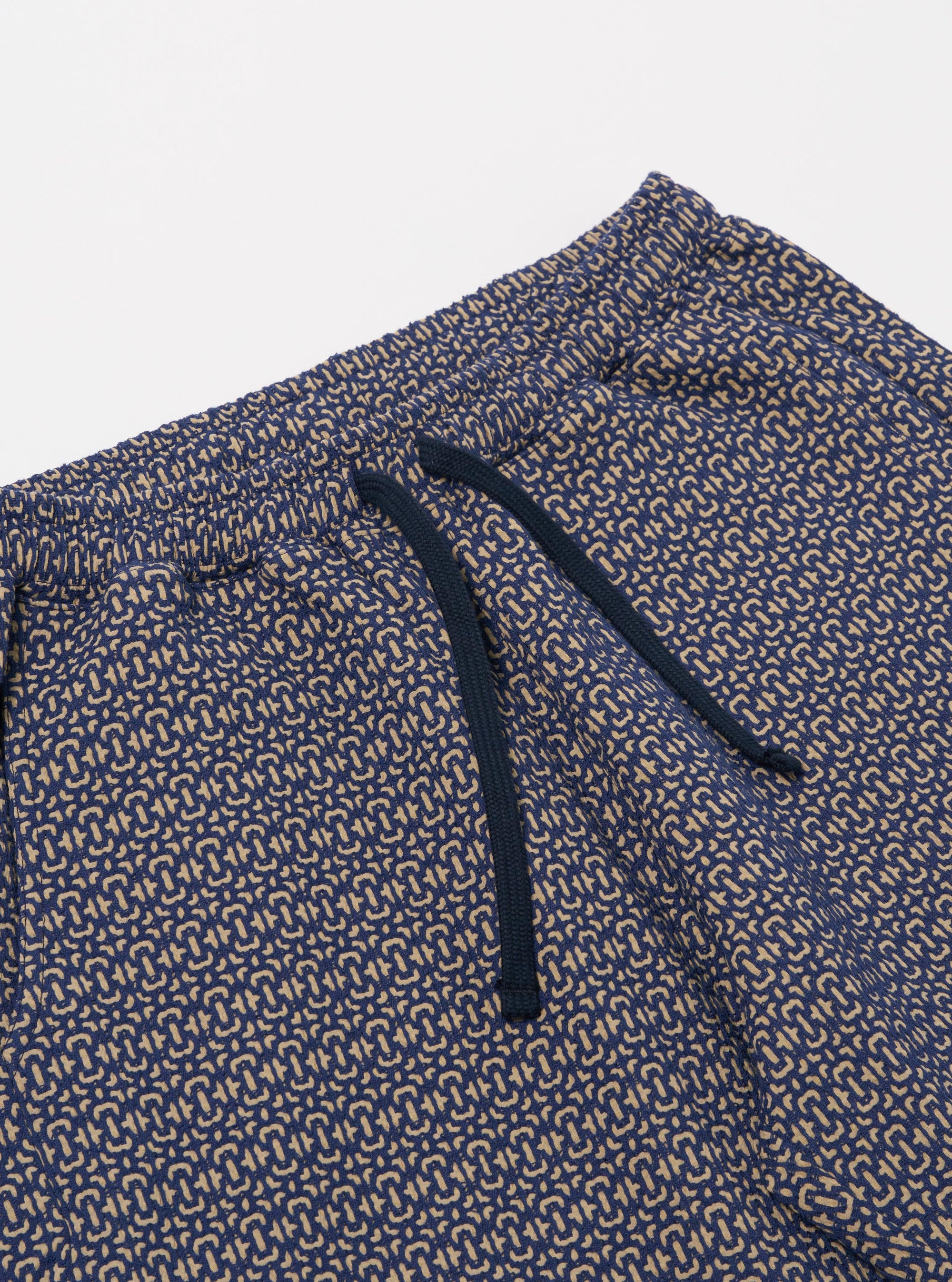 The Navy Konos Cotton Simple Short is shown from the back as a flat lay against a plain white background. The shorts feature an elasticated waistband and a single patch pocket on the right rear side. The fabric is a dark navy cotton with a subtle, textured pattern.