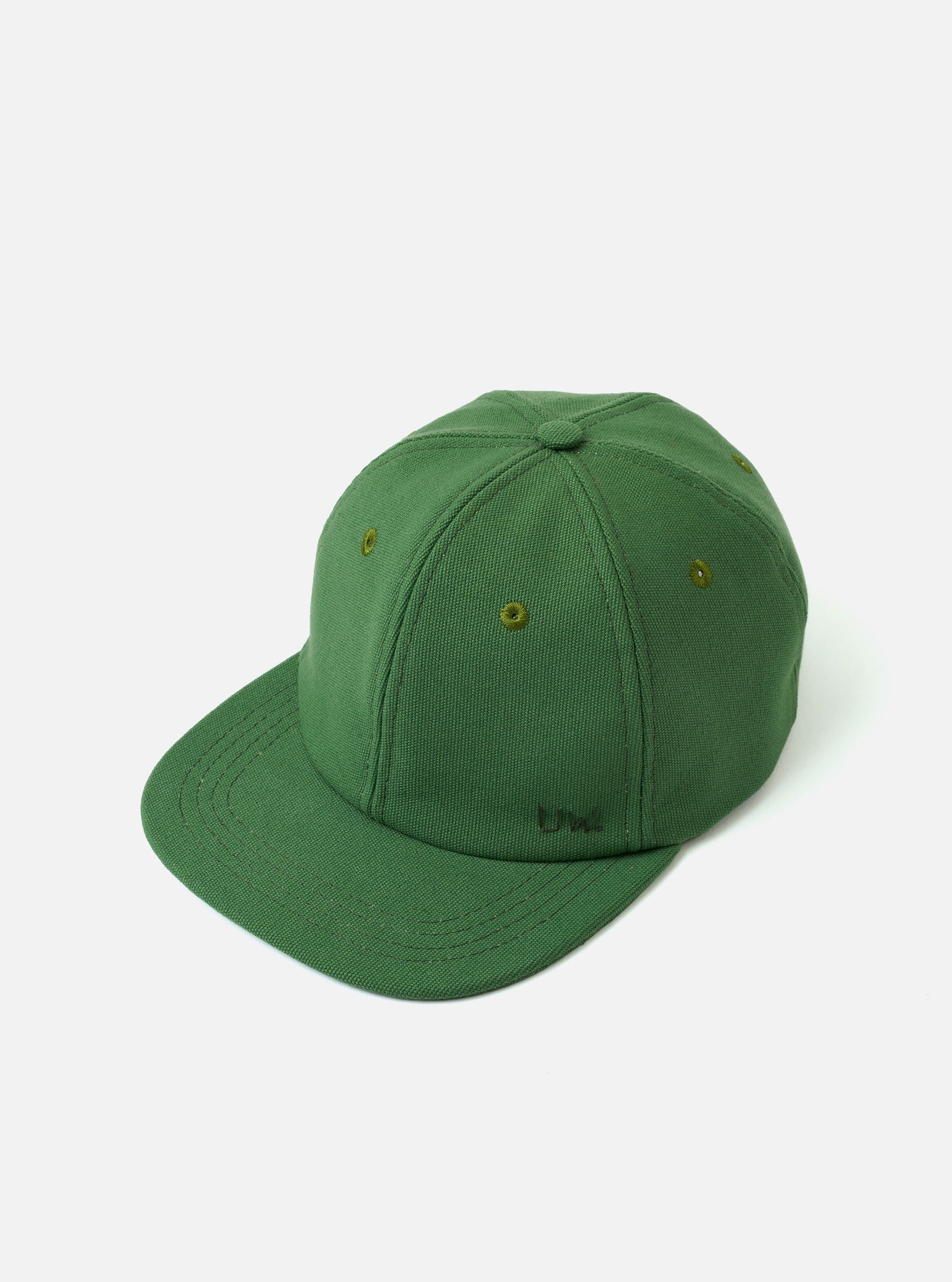 The Green Canvas Baseball Hat is shown from a rear angle as a flat lay against a plain white background. The image highlights the adjustable fabric strap with a metal buckle and the structured back of the crown. The green cotton canvas fabric has a visible, durable texture with tonal stitching.