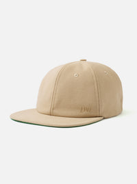 The Sand Canvas Baseball Hat is shown as a flat lay against a plain white background. The hat features a classic six-panel construction with a curved peak and a matching button at the top. The sand-colored cotton canvas fabric has a visible durable texture.