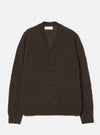 Brown alpaca knit cardigan laid flat on a light grey seamless backdrop. Deep V-neckline with a five-button placket in dark tonal buttons. Raglan sleeves with ribbed cuffs and a ribbed hem. Soft, slightly fluffy knit texture throughout. Universal Works woven label visible at the inner neckline.