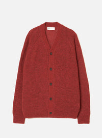 Deep orange alpaca knit cardigan laid flat on a light grey studio backdrop. V-neckline with a woven Universal Works label at the back neck. Five dark brown buttons run down the centre front. Raglan sleeves with ribbed cuffs and a ribbed hem. Soft, fluffy knit texture throughout.
