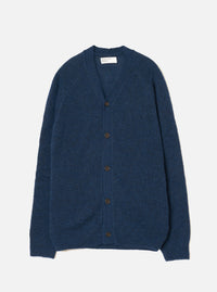 Navy alpaca knit cardigan laid flat on a light grey seamless backdrop. Features a V-neckline, raglan sleeves, and five dark brown buttons down the centre front. Ribbed cuffs and hem visible. The fluffy, brushed texture of the alpaca knit is evident across the body. A Universal Works woven label sits at the inner neck.
