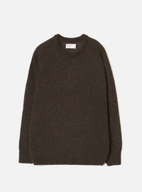 Brown alpaca knit crew neck sweater laid flat on a light grey studio backdrop. Ribbed crew neck collar with a woven Universal Works label at the back. Soft, slightly fluffy alpaca knit texture throughout. Ribbed cuffs and hem. Long sleeves. No fastenings.