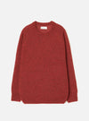 Deep orange marl alpaca knit crew neck jumper, flat lay on a light grey seamless backdrop. Ribbed crew neckline with a woven brand label at the back, ribbed cuffs and hem. Soft, fluffy knit texture throughout with a relaxed, boxy silhouette and long sleeves.