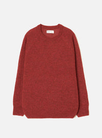 Deep orange marl alpaca knit crew neck jumper, flat lay on a light grey seamless backdrop. Ribbed crew neckline with a woven brand label at the back, ribbed cuffs and hem. Soft, fluffy knit texture throughout with a relaxed, boxy silhouette and long sleeves.