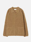 Tawny eco wool zip cardigan in camel marl, flat lay on a light grey seamless backdrop. Ribbed knit throughout with a spread collar, full-length bronze zip and two patch pockets at the hem. Ribbed cuffs and hem band. Universal Works woven label at the neckline.