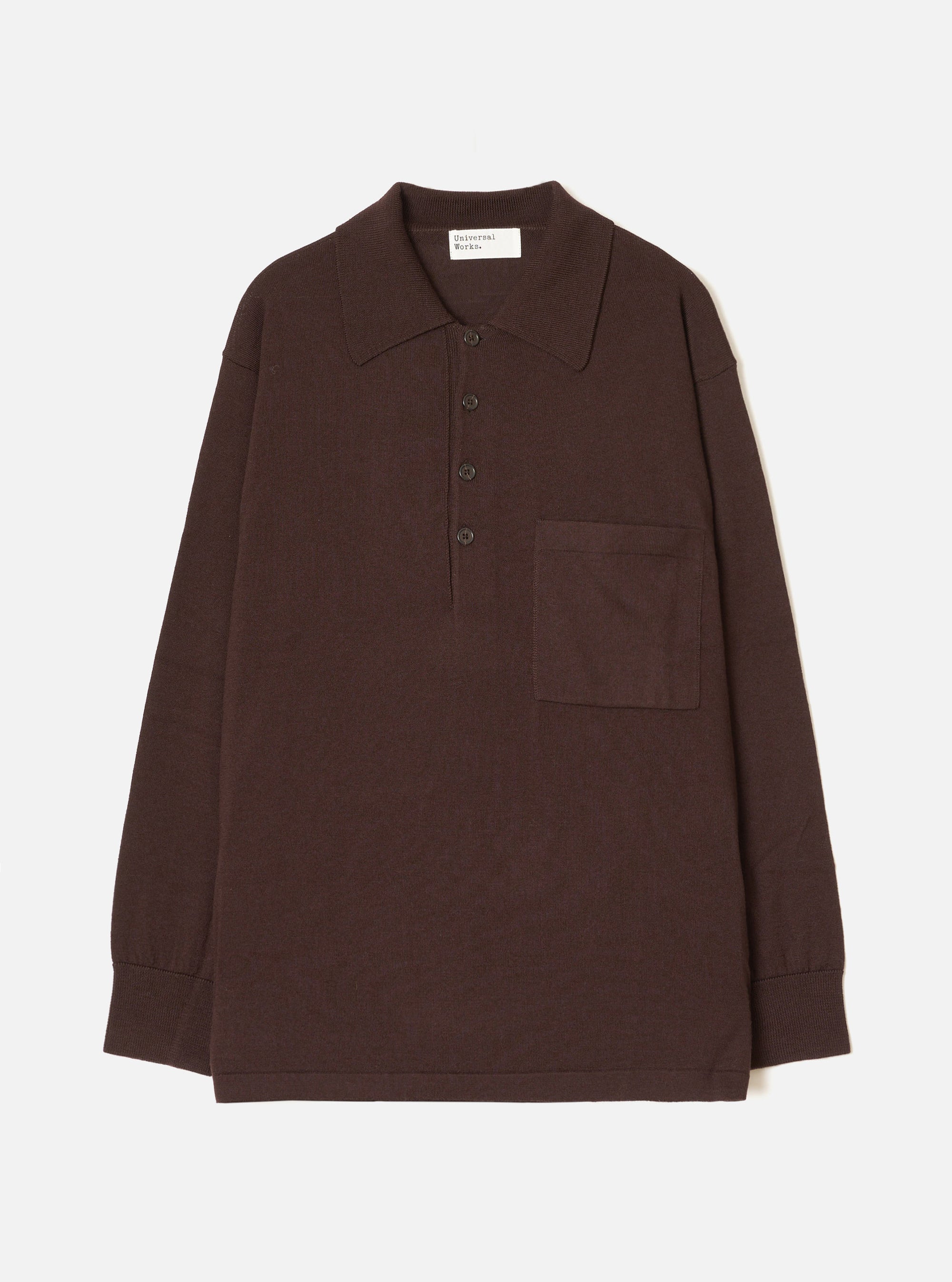Espresso brown merino knit pullover shirt laid flat on a white studio backdrop. Features a pointed polo collar, four-button placket, single patch chest pocket, long sleeves with ribbed cuffs, and a ribbed hem. Universal Works woven label visible at the back neck.
