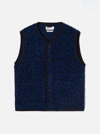 Blue boucle style fleece gilet laid flat on a light grey studio backdrop. V-neckline with dark navy binding trim running around the neck, armholes, front placket and hem. Five dark horn-effect buttons down the centre front. Two patch pockets at the lower front. Textured blue and black marl boucle style fabric throughout. Universal Works label visible at the neckline.