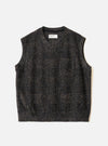 Navy sleeveless crew-neck knit vest laid flat on a light grey surface. The textured fabric features a muted check pattern in navy and tan. A Universal Works woven label sits inside the crew neck. The armholes are wide and the hem is straight and ribbed.