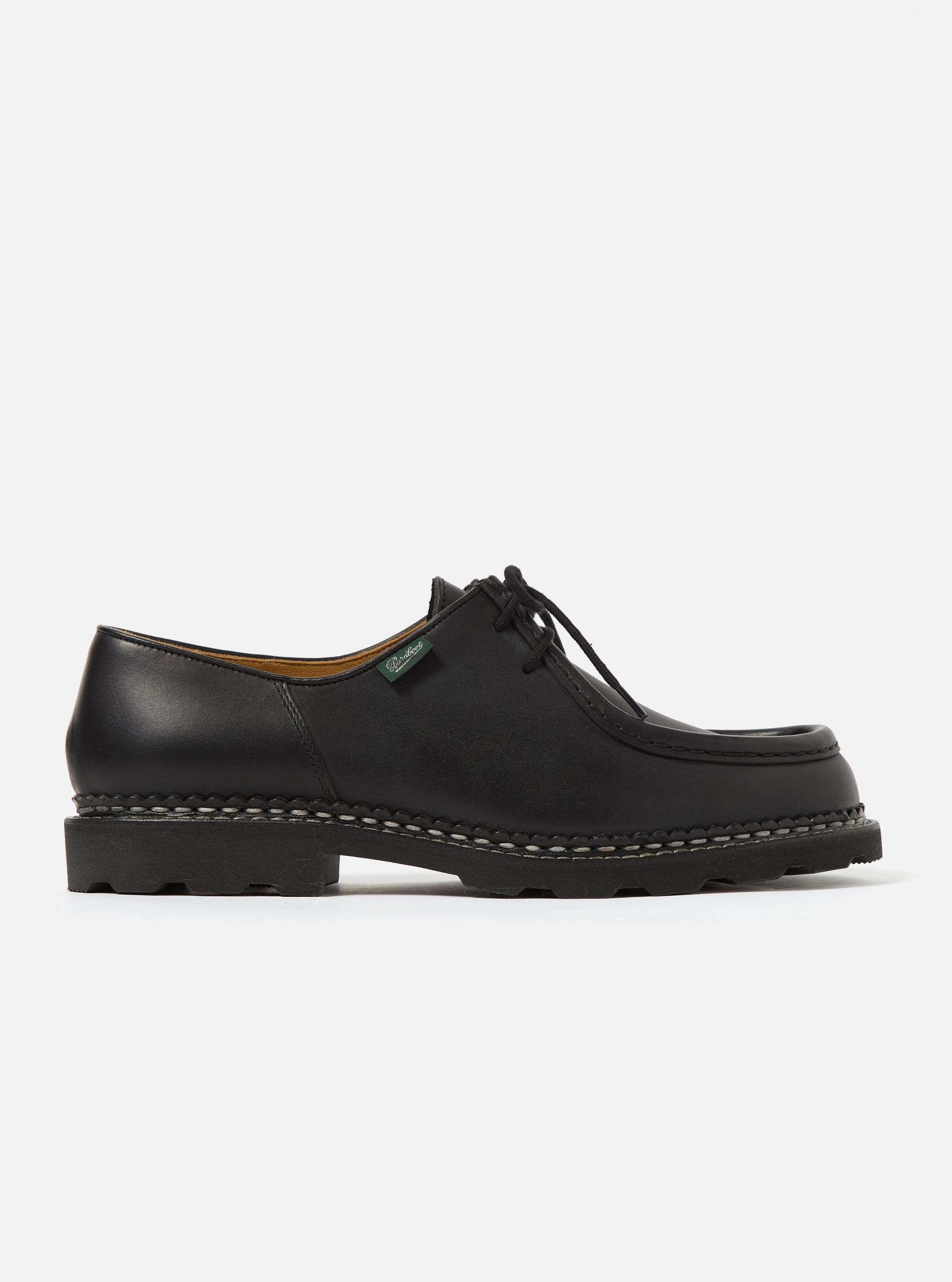 Side view of Paraboot Black Leather Michael Marche II shoe on a white background. The shoe is black leather with a thick sole and lace-up closure.