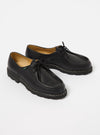 Paraboot Black Leather Michael Marche II shoes on a white surface. The leather shoes have black laces and a thick black sole with white stitching.