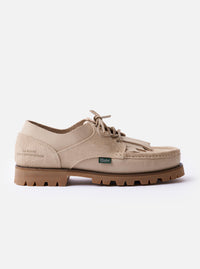 The Paraboot x Universal Works Thiers/Jannu in Sand Leather/Suede is shown from a side profile against a plain white background. The shoe features a light beige sand color with a mix of smooth leather and textured suede panels. Notable details include four metal eyelets with tonal laces, piped seams, and a thick vulcanized natural rubber sole.