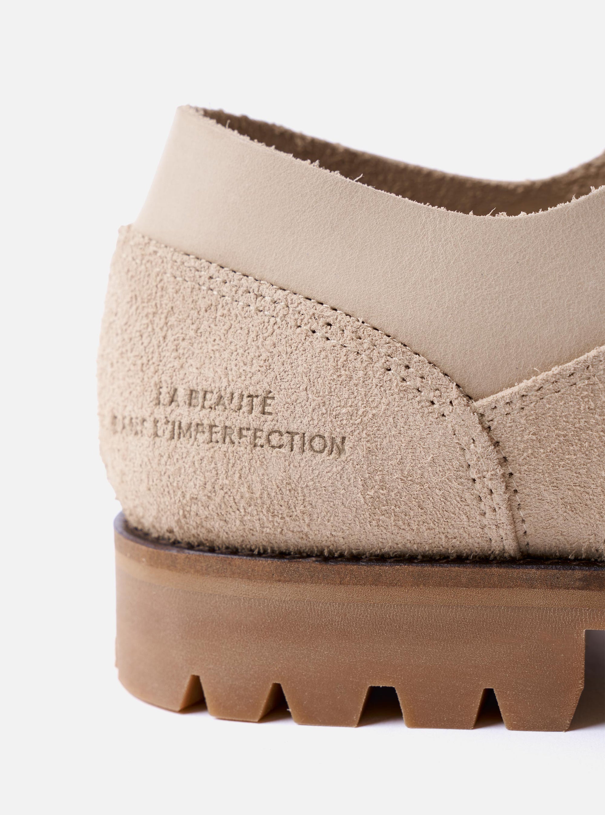 The Paraboot x Universal Works Thiers/Jannu in Sand Leather/Suede is shown from a side profile as a flat lay against a white background. The shoe features a combination of smooth sand-colored leather and textured suede, with four metal eyelets and light-colored laces. It has a chunky, lugged natural rubber sole with visible Blake stitch construction.