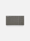 Close-up of the A. SOCIETY x Universal Works Grey Aberdeen Sunglasses box. The box is grey with a blueprint design of the sunglasses on it.
