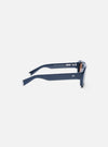 Side view of A. SOCIETY x Universal Works Navy Aberdeen Sunglasses on a white background. The frames are navy with silver accents. The lenses are a light brown tint.