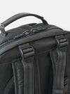 Close-up of the F/CE.® Grey Recycled Nylon 420 re/cor Travel Backpack. Shows grey nylon material, black zippers and straps. Shot against a white background.
