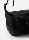 Close-up of the F/CE.® Black Nylon Cordura Sil Sacoche on a white background. The bag features a black nylon material with a grid pattern and a black strap.