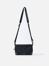 The F/CE.® Black Nylon Textured Twill Drawstring Sacoche bag on a white background. The black bag has a long strap and textured nylon.
