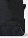 Close-up of the F/CE.® Black Nylon Textured Twill Drawstring Sacoche on a white surface. Shows the textured nylon, drawstring detail, and subtle branding.