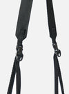 Close-up of the black nylon textured twill drawstring sacoche strap and buckle against a white backdrop. The F/CE.® sacoche is durable and stylish.