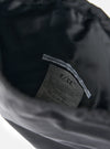 Close-up of the inside of the F/CE.® Black Nylon Textured Twill Drawstring Sacoche, showing the material and brand label on a white background.