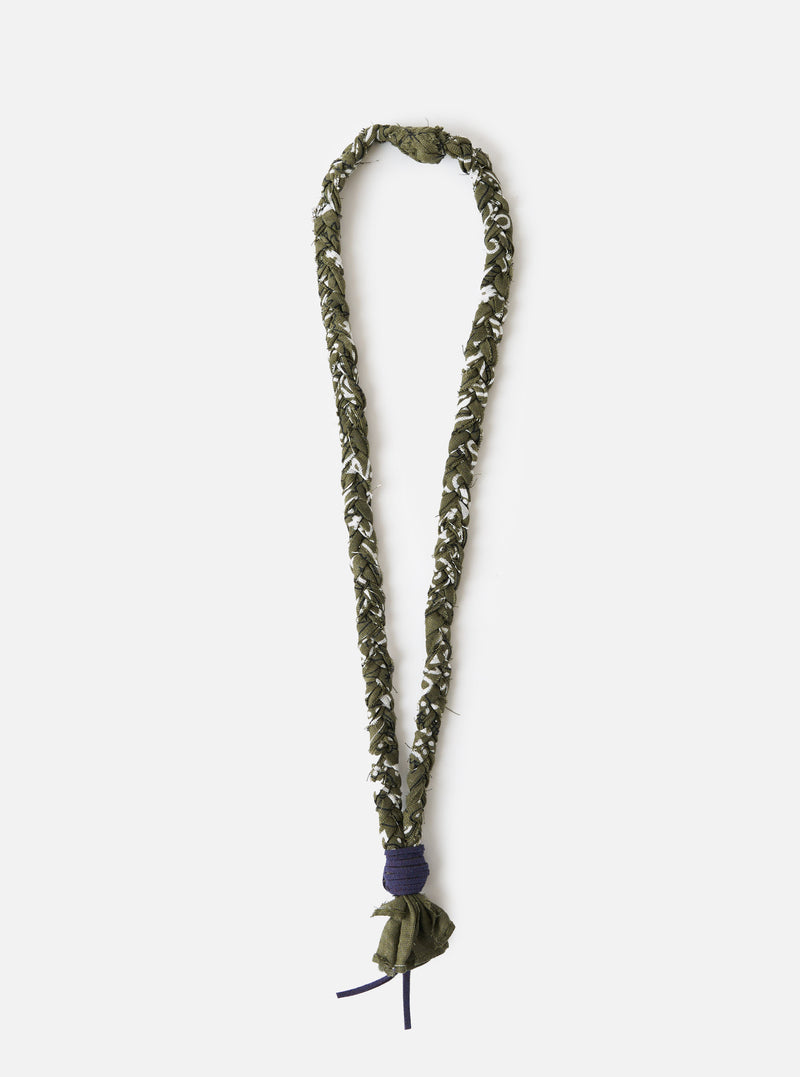 An overhead image of the Hanami of Rome Military Green/Blue Leather Bandana Necklace No.46 on a white background. The necklace is a mixture of green, blue and white in an assymetric pattern.