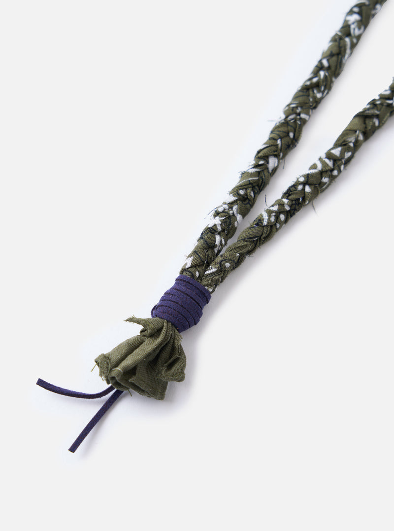 Close-up of the Hanami of Rome Military Green/Blue Leather Bandana Necklace No.46 on a white background. The necklace features a braided green and white pattern with blue leather accents.